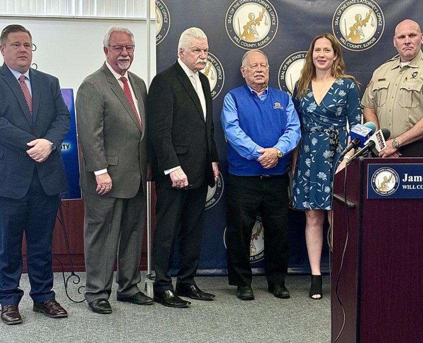 Will County Crime Stoppers President David Silverman, Will County State’s Attorney James W. Glasgow, First Secure Bank Group Chairman of the Board Of Directors Jay Bergman, Will County Animal Protection Services Administrator Anna Payton, and Will County Sheriff Deputy Chief Jeremy Zdzinicki
